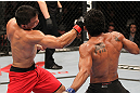 BELO HORIZONTE, BRAZIL - JUNE 23:   (L-R) John Teixeira punches Hugo "Wolverine" Viana during their UFC 147 featherweight bout at Estadio Jornalista Felipe Drummond on June 23, 2012 in Belo Horizonte, Brazil.  (Photo by Josh Hedges/Zuffa LLC/Zuffa LLC via Getty Images)