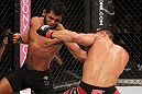 BELO HORIZONTE, BRAZIL - JUNE 23:   (L-R) Hugo "Wolverine" Viana punches John Teixeira during their UFC 147 featherweight bout at Estadio Jornalista Felipe Drummond on June 23, 2012 in Belo Horizonte, Brazil.  (Photo by Josh Hedges/Zuffa LLC/Zuffa LLC via Getty Images)