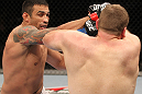 BELO HORIZONTE, BRAZIL - JUNE 23:   (L-R) Fabricio Werdum punches Mike Russow during their UFC 147 heavyweight bout at Estadio Jornalista Felipe Drummond on June 23, 2012 in Belo Horizonte, Brazil.  (Photo by Josh Hedges/Zuffa LLC/Zuffa LLC via Getty Images)