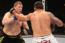 BELO HORIZONTE, BRAZIL - JUNE 23:   (R-L) Fabricio Werdum punches Mike Russow during their UFC 147 heavyweight bout at Estadio Jornalista Felipe Drummond on June 23, 2012 in Belo Horizonte, Brazil.  (Photo by Josh Hedges/Zuffa LLC/Zuffa LLC via Getty Images)
