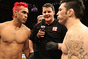 BELO HORIZONTE, BRAZIL - JUNE 23:   (L-R) Opponents Godofredo Pepey and Rony "Jason" Mariano Bezerra receive final instructions from the referee before their UFC 147 featherweight bout at Estadio Jornalista Felipe Drummond on June 23, 2012 in Belo Horizonte, Brazil.  (Photo by Josh Hedges/Zuffa LLC/Zuffa LLC via Getty Images)