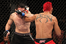 BELO HORIZONTE, BRAZIL - JUNE 23:   (R-L) Godofredo Pepey and Rony "Jason" Mariano Bezerra trade punhces during their UFC 147 featherweight bout at Estadio Jornalista Felipe Drummond on June 23, 2012 in Belo Horizonte, Brazil.  (Photo by Josh Hedges/Zuffa LLC/Zuffa LLC via Getty Images)