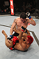 BELO HORIZONTE, BRAZIL - JUNE 23:   Rony "Jason" Mariano Bezerra (top) punches Godofredo Pepey during their UFC 147 featherweight bout at Estadio Jornalista Felipe Drummond on June 23, 2012 in Belo Horizonte, Brazil.  (Photo by Josh Hedges/Zuffa LLC/Zuffa LLC via Getty Images)