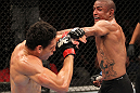 BELO HORIZONTE, BRAZIL - JUNE 23:   (R-L) Sergio "Serginho" Moraes punches Cezar "Mutante" Ferreira during their UFC 147 middleweight bout at Estadio Jornalista Felipe Drummond on June 23, 2012 in Belo Horizonte, Brazil.  (Photo by Josh Hedges/Zuffa LLC/Zuffa LLC via Getty Images)
