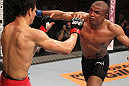 BELO HORIZONTE, BRAZIL - JUNE 23:   (R-L) Sergio "Serginho" Moraes punches Cezar "Mutante" Ferreira during their UFC 147 middleweight bout at Estadio Jornalista Felipe Drummond on June 23, 2012 in Belo Horizonte, Brazil.  (Photo by Josh Hedges/Zuffa LLC/Zuffa LLC via Getty Images)