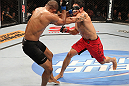 BELO HORIZONTE, BRAZIL - JUNE 23:   (R-L) Cezar "Mutante" Ferreira punches Sergio "Serginho" Moraes during their UFC 147 middleweight bout at Estadio Jornalista Felipe Drummond on June 23, 2012 in Belo Horizonte, Brazil.  (Photo by Josh Hedges/Zuffa LLC/Zuffa LLC via Getty Images)