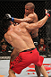 BELO HORIZONTE, BRAZIL - JUNE 23:   (R-L) Sergio "Serginho" Moraes punches Cezar "Mutante" Ferreira during their UFC 147 middleweight bout at Estadio Jornalista Felipe Drummond on June 23, 2012 in Belo Horizonte, Brazil.  (Photo by Josh Hedges/Zuffa LLC/Zuffa LLC via Getty Images)