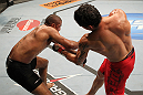 BELO HORIZONTE, BRAZIL - JUNE 23:   (R-L) Cezar "Mutante" Ferreira punches Sergio "Serginho" Moraes during their UFC 147 middleweight bout at Estadio Jornalista Felipe Drummond on June 23, 2012 in Belo Horizonte, Brazil.  (Photo by Josh Hedges/Zuffa LLC/Zuffa LLC via Getty Images)