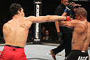 BELO HORIZONTE, BRAZIL - JUNE 23:   (L-R) Cezar "Mutante" Ferreira punches Sergio "Serginho" Moraes during their UFC 147 middleweight bout at Estadio Jornalista Felipe Drummond on June 23, 2012 in Belo Horizonte, Brazil.  (Photo by Josh Hedges/Zuffa LLC/Zuffa LLC via Getty Images)