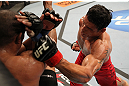 BELO HORIZONTE, BRAZIL - JUNE 23:   (R-L) Cezar "Mutante" Ferreira punches Sergio "Serginho" Moraes during their UFC 147 middleweight bout at Estadio Jornalista Felipe Drummond on June 23, 2012 in Belo Horizonte, Brazil.  (Photo by Josh Hedges/Zuffa LLC/Zuffa LLC via Getty Images)