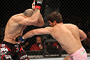 BELO HORIZONTE, BRAZIL - JUNE 23:   (R-L) Rich Franklin punches Wanderlei Silva during their UFC 147 catchweight bout at Estadio Jornalista Felipe Drummond on June 23, 2012 in Belo Horizonte, Brazil.  (Photo by Josh Hedges/Zuffa LLC/Zuffa LLC via Getty Images)