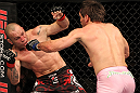 BELO HORIZONTE, BRAZIL - JUNE 23:   (R-L) Rich Franklin punches Wanderlei Silva during their UFC 147 catchweight bout at Estadio Jornalista Felipe Drummond on June 23, 2012 in Belo Horizonte, Brazil.  (Photo by Josh Hedges/Zuffa LLC/Zuffa LLC via Getty Images)