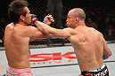 BELO HORIZONTE, BRAZIL - JUNE 23:   (R-L) Wanderlei Silva punches Rich Franklin during their UFC 147 catchweight bout at Estadio Jornalista Felipe Drummond on June 23, 2012 in Belo Horizonte, Brazil.  (Photo by Josh Hedges/Zuffa LLC/Zuffa LLC via Getty Images)
