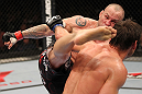 BELO HORIZONTE, BRAZIL - JUNE 23:   (L-R) Wanderlei Silva kicks Rich Franklin during their UFC 147 catchweight bout at Estadio Jornalista Felipe Drummond on June 23, 2012 in Belo Horizonte, Brazil.  (Photo by Josh Hedges/Zuffa LLC/Zuffa LLC via Getty Images)