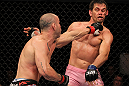BELO HORIZONTE, BRAZIL - JUNE 23:   (L-R) Wanderlei Silva punches Rich Franklin during their UFC 147 catchweight bout at Estadio Jornalista Felipe Drummond on June 23, 2012 in Belo Horizonte, Brazil.  (Photo by Josh Hedges/Zuffa LLC/Zuffa LLC via Getty Images)