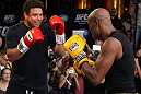 LAS VEGAS, NV - JULY 5:   (R-L) UFC Middleweight Champion Anderson Silva spars with Brazilian soccer legend Ronaldo during the UFC 148 Open Workouts inside XS nightclub at the Encore on July 5, 2012 in Las Vegas, Nevada.  (Photo by Josh Hedges/Zuffa LLC/Zuffa LLC via Getty Images)