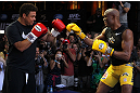 LAS VEGAS, NV - JULY 5:   (R-L) UFC Middleweight Champion Anderson Silva spars with Brazilian soccer legend Ronaldo during the UFC 148 Open Workouts inside XS nightclub at the Encore on July 5, 2012 in Las Vegas, Nevada.  (Photo by Josh Hedges/Zuffa LLC/Zuffa LLC via Getty Images)