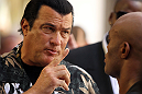 LAS VEGAS, NV - JULY 5:   (L-R) Actor Steven Seagal gives advice to Anderson Silva during the UFC 148 Open Workouts inside XS nightclub at the Encore on July 5, 2012 in Las Vegas, Nevada.  (Photo by Josh Hedges/Zuffa LLC/Zuffa LLC via Getty Images)