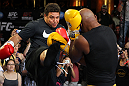 LAS VEGAS, NV - JULY 5:   (R-L) UFC Middleweight Champion Anderson Silva spars with Brazilian soccer legend Ronaldo during the UFC 148 Open Workouts inside XS nightclub at the Encore on July 5, 2012 in Las Vegas, Nevada.  (Photo by Josh Hedges/Zuffa LLC/Zuffa LLC via Getty Images)