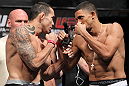 LAS VEGAS, NV - JULY 6:   (L-R) Opponents Rafaello Oliveira and Yoislandy Izquierdo face off during the UFC 148 Weigh In at the Mandalay Bay Events Center on July 6, 2012 in Las Vegas, Nevada.  (Photo by Josh Hedges/Zuffa LLC/Zuffa LLC via Getty Images)