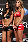 LAS VEGAS, NV - JULY 6:   (R-L) UFC Octagon Girls Brittney Palmer and Arianny Celeste stand on stage during the UFC 148 Weigh In at the Mandalay Bay Events Center on July 6, 2012 in Las Vegas, Nevada.  (Photo by Josh Hedges/Zuffa LLC/Zuffa LLC via Getty Images)