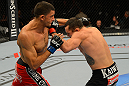 LAS VEGAS, NV - JULY 7:   (L-R) Yoislandy Izquierdo and Rafaello Oliveira exchange punches during their lightweight bout at UFC 148 inside MGM Grand Garden Arena on July 7, 2012 in Las Vegas, Nevada.  (Photo by Donald Miralle/Zuffa LLC/Zuffa LLC via Getty Images)  *** Local Caption *** Yoislandy Izquierdo; Rafaello Oliveira