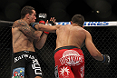 LAS VEGAS, NV - JULY 7:   (R-L) Yoislandy Izquierdo punches Rafaello Oliveira during their lightweight bout at UFC 148 inside MGM Grand Garden Arena on July 7, 2012 in Las Vegas, Nevada.  (Photo by Josh Hedges/Zuffa LLC/Zuffa LLC via Getty Images)  *** Local Caption *** Yoislandy Izquierdo; Rafaello Oliveira