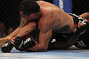 LAS VEGAS, NV - JULY 7:   Rafaello Oliveira (top) attempts to submit Yoislandy Izquierdo during their lightweight bout at UFC 148 inside MGM Grand Garden Arena on July 7, 2012 in Las Vegas, Nevada.  (Photo by Josh Hedges/Zuffa LLC/Zuffa LLC via Getty Images)  *** Local Caption *** Yoislandy Izquierdo; Rafaello Oliveira