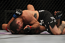 LAS VEGAS, NV - JULY 7:   Rafaello Oliveira (top) elbows Yoislandy Izquierdo during their lightweight bout at UFC 148 inside MGM Grand Garden Arena on July 7, 2012 in Las Vegas, Nevada.  (Photo by Josh Hedges/Zuffa LLC/Zuffa LLC via Getty Images)  *** Local Caption *** Yoislandy Izquierdo; Rafaello Oliveira