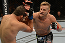 LAS VEGAS, NV - JULY 7:   (R-L) John Alessio punches Shane Roller during their lightweight bout at UFC 148 inside MGM Grand Garden Arena on July 7, 2012 in Las Vegas, Nevada.  (Photo by Donald Miralle/Zuffa LLC/Zuffa LLC via Getty Images)  *** Local Caption *** John Alessio; Shane Roller