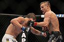 LAS VEGAS, NV - JULY 7:   (R-L) John Alessio punches Shane Roller during their lightweight bout at UFC 148 inside MGM Grand Garden Arena on July 7, 2012 in Las Vegas, Nevada.  (Photo by Josh Hedges/Zuffa LLC/Zuffa LLC via Getty Images)  *** Local Caption *** John Alessio; Shane Roller