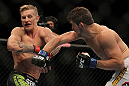 LAS VEGAS, NV - JULY 7:   (R-L) Shane Roller punches John Alessio during their lightweight bout at UFC 148 inside MGM Grand Garden Arena on July 7, 2012 in Las Vegas, Nevada.  (Photo by Josh Hedges/Zuffa LLC/Zuffa LLC via Getty Images)  *** Local Caption *** John Alessio; Shane Roller