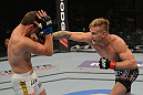 LAS VEGAS, NV - JULY 7:   (R-L) John Alessio punches Shane Roller during their lightweight bout at UFC 148 inside MGM Grand Garden Arena on July 7, 2012 in Las Vegas, Nevada.  (Photo by Donald Miralle/Zuffa LLC/Zuffa LLC via Getty Images)  *** Local Caption *** John Alessio; Shane Roller
