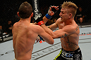 LAS VEGAS, NV - JULY 7:   (R-L) John Alessio punches Shane Roller during their lightweight bout at UFC 148 inside MGM Grand Garden Arena on July 7, 2012 in Las Vegas, Nevada.  (Photo by Donald Miralle/Zuffa LLC/Zuffa LLC via Getty Images)  *** Local Caption *** John Alessio; Shane Roller
