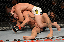 LAS VEGAS, NV - JULY 7:   Shane Roller (top) attempts to submit John Alessio during their lightweight bout at UFC 148 inside MGM Grand Garden Arena on July 7, 2012 in Las Vegas, Nevada.  (Photo by Donald Miralle/Zuffa LLC/Zuffa LLC via Getty Images)  *** Local Caption *** John Alessio; Shane Roller