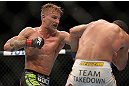 LAS VEGAS, NV - JULY 7:   (L-R) John Alessio punches Shane Roller during their lightweight bout at UFC 148 inside MGM Grand Garden Arena on July 7, 2012 in Las Vegas, Nevada.  (Photo by Josh Hedges/Zuffa LLC/Zuffa LLC via Getty Images)  *** Local Caption *** John Alessio; Shane Roller