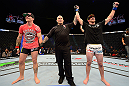 LAS VEGAS, NV - JULY 7:   Shane Roller (right) reacts to being declared the winner over John Alessio during their lightweight bout at UFC 148 inside MGM Grand Garden Arena on July 7, 2012 in Las Vegas, Nevada.  (Photo by Donald Miralle/Zuffa LLC/Zuffa LLC via Getty Images)  *** Local Caption *** John Alessio; Shane Roller