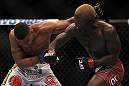 LAS VEGAS, NV - JULY 7:   Mevlin Guillard (right) punches Fabricio Camoes during their lightweight bout at UFC 148 inside MGM Grand Garden Arena on July 7, 2012 in Las Vegas, Nevada.  (Photo by Josh Hedges/Zuffa LLC/Zuffa LLC via Getty Images)  *** Local Caption *** Melvin Guillard; Fabricio Camoes