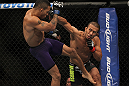 LAS VEGAS, NV - JULY 7:   (R-L) Ivan Menjivar punches Mike Easton during their bantamweight bout at UFC 148 inside MGM Grand Garden Arena on July 7, 2012 in Las Vegas, Nevada.  (Photo by Josh Hedges/Zuffa LLC/Zuffa LLC via Getty Images)  *** Local Caption *** Ivan Menjivar; Mike Easton