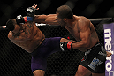LAS VEGAS, NV - JULY 7:   (R-L) Ivan Menjivar punches Mike Easton during their bantamweight bout at UFC 148 inside MGM Grand Garden Arena on July 7, 2012 in Las Vegas, Nevada.  (Photo by Josh Hedges/Zuffa LLC/Zuffa LLC via Getty Images)  *** Local Caption *** Ivan Menjivar; Mike Easton