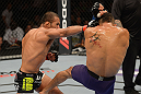 LAS VEGAS, NV - JULY 7:   (L-R) Ivan Menjivar punches Mike Easton during their bantamweight bout at UFC 148 inside MGM Grand Garden Arena on July 7, 2012 in Las Vegas, Nevada.  (Photo by Donald Miralle/Zuffa LLC/Zuffa LLC via Getty Images)  *** Local Caption *** Ivan Menjivar; Mike Easton
