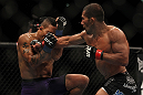LAS VEGAS, NV - JULY 7:   (R-L) Ivan Menjivar punches Mike Easton during their bantamweight bout at UFC 148 inside MGM Grand Garden Arena on July 7, 2012 in Las Vegas, Nevada.  (Photo by Josh Hedges/Zuffa LLC/Zuffa LLC via Getty Images)  *** Local Caption *** Ivan Menjivar; Mike Easton