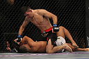 LAS VEGAS, NV - JULY 7:   Demian Maia (top) punches Dong Hyun Kim during their welterweight bout at UFC 148 inside MGM Grand Garden Arena on July 7, 2012 in Las Vegas, Nevada.  (Photo by Josh Hedges/Zuffa LLC/Zuffa LLC via Getty Images)  *** Local Caption *** Demian Maia; Dong Hyun Kim