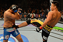 LAS VEGAS, NV - JULY 7:   (R-L) Cung Le kicks Patrick Cote during their middleweight bout at UFC 148 inside MGM Grand Garden Arena on July 7, 2012 in Las Vegas, Nevada.  (Photo by Donald Miralle/Zuffa LLC/Zuffa LLC via Getty Images)  *** Local Caption *** Cung Le; Patrick Cote