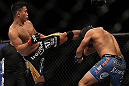 LAS VEGAS, NV - JULY 7:   (L-R) Cung Le kicks Patrick Cote during their middleweight bout at UFC 148 inside MGM Grand Garden Arena on July 7, 2012 in Las Vegas, Nevada.  (Photo by Josh Hedges/Zuffa LLC/Zuffa LLC via Getty Images)  *** Local Caption *** Cung Le; Patrick Cote