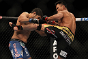 LAS VEGAS, NV - JULY 7:   (R-L) Cung Le kicks Patrick Cote during their middleweight bout at UFC 148 inside MGM Grand Garden Arena on July 7, 2012 in Las Vegas, Nevada.  (Photo by Josh Hedges/Zuffa LLC/Zuffa LLC via Getty Images)  *** Local Caption *** Cung Le; Patrick Cote