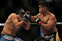 LAS VEGAS, NV - JULY 7:   (R-L) Cung Le punches Patrick Cote during their middleweight bout at UFC 148 inside MGM Grand Garden Arena on July 7, 2012 in Las Vegas, Nevada.  (Photo by Josh Hedges/Zuffa LLC/Zuffa LLC via Getty Images)  *** Local Caption *** Cung Le; Patrick Cote