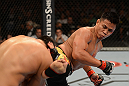 LAS VEGAS, NV - JULY 7:   Cung Le (right) kicks Patrick Cote during their middleweight bout at UFC 148 inside MGM Grand Garden Arena on July 7, 2012 in Las Vegas, Nevada.  (Photo by Donald Miralle/Zuffa LLC/Zuffa LLC via Getty Images)  *** Local Caption *** Cung Le; Patrick Cote