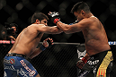 LAS VEGAS, NV - JULY 7:   (L-R) Patrick Cote punches Cung Le during their middleweight bout at UFC 148 inside MGM Grand Garden Arena on July 7, 2012 in Las Vegas, Nevada.  (Photo by Josh Hedges/Zuffa LLC/Zuffa LLC via Getty Images)  *** Local Caption *** Cung Le; Patrick Cote