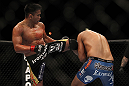 LAS VEGAS, NV - JULY 7:   Cung Le (left) kicks Patrick Cote during their middleweight bout at UFC 148 inside MGM Grand Garden Arena on July 7, 2012 in Las Vegas, Nevada.  (Photo by Josh Hedges/Zuffa LLC/Zuffa LLC via Getty Images)  *** Local Caption *** Cung Le; Patrick Cote